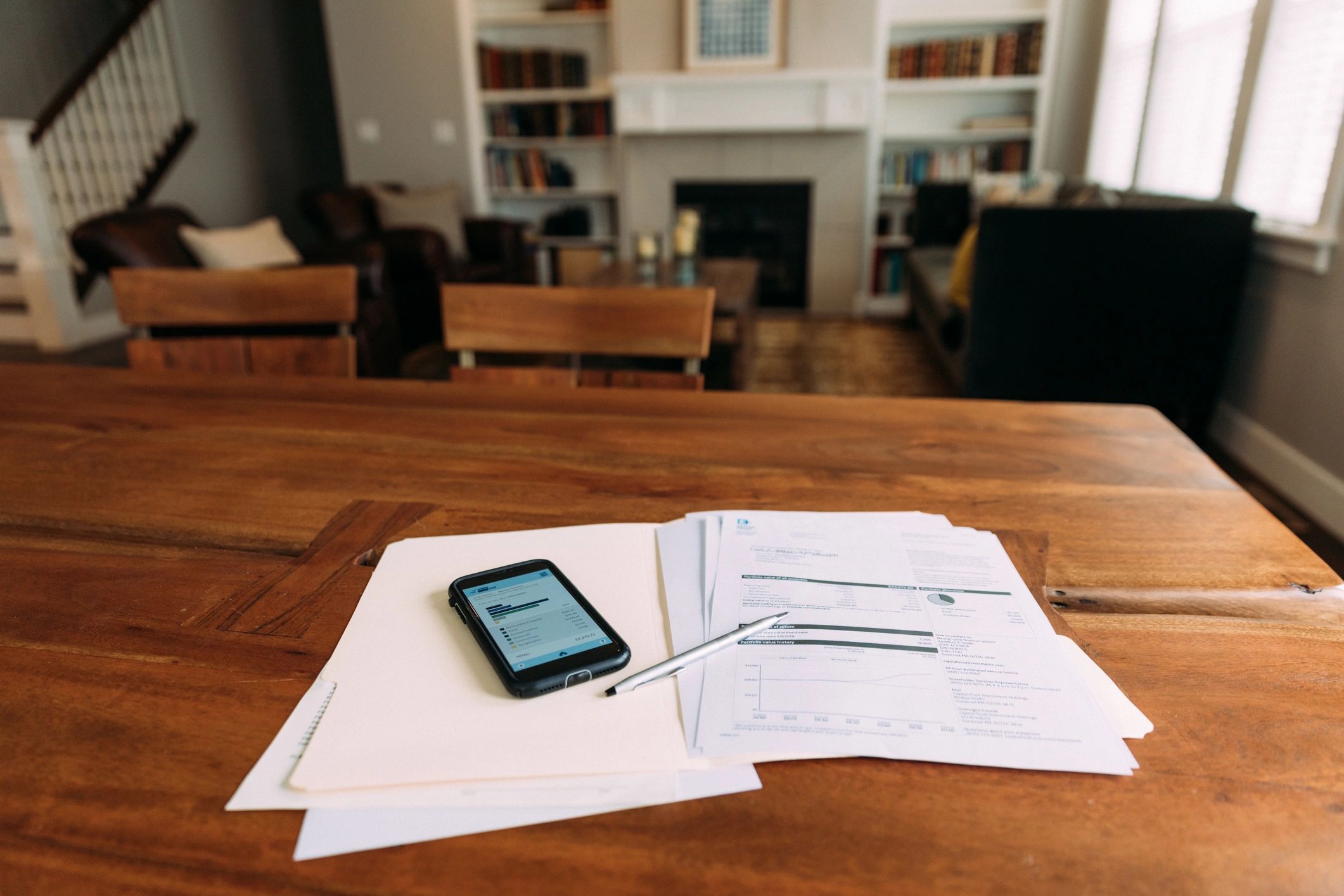 Financial documents and calculator on a home desk