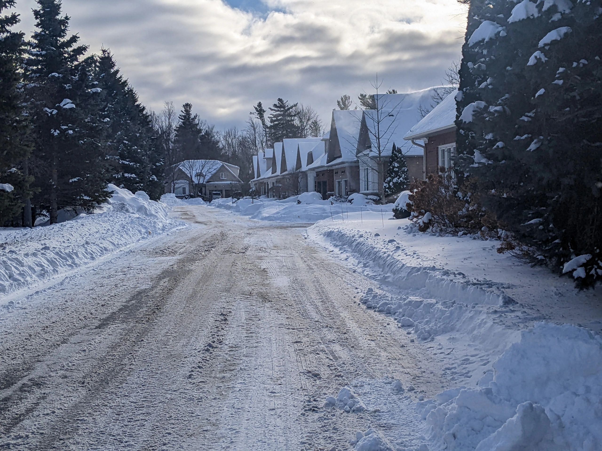 Residential street with detached homes, representing neighborhood zoning context