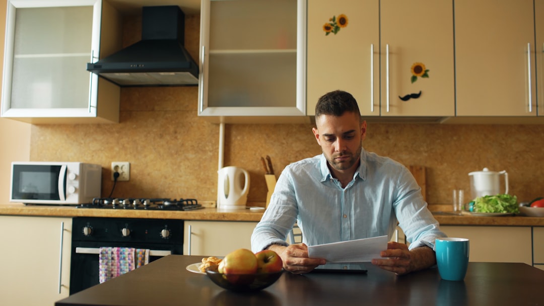 Ontario home buyer reviewing mortgage pre-approval documents at a kitchen table